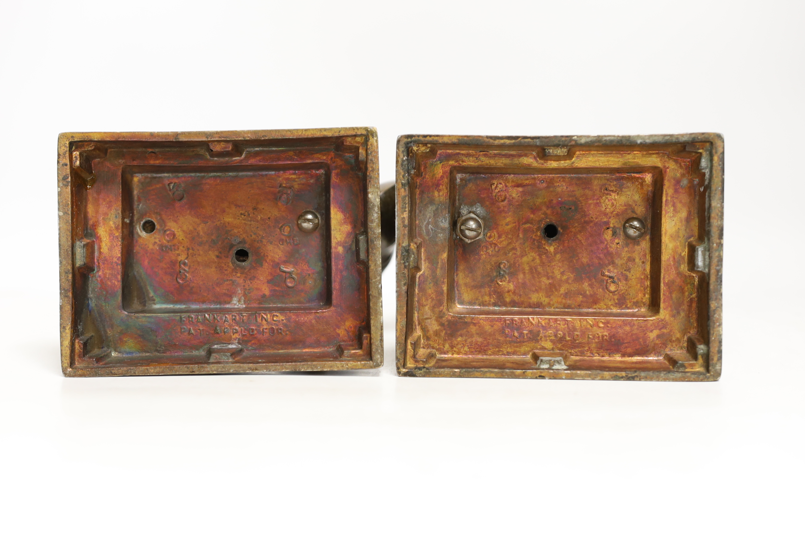 A pair of Art Deco Frankart Inc. patinated metal bookends, 16cm